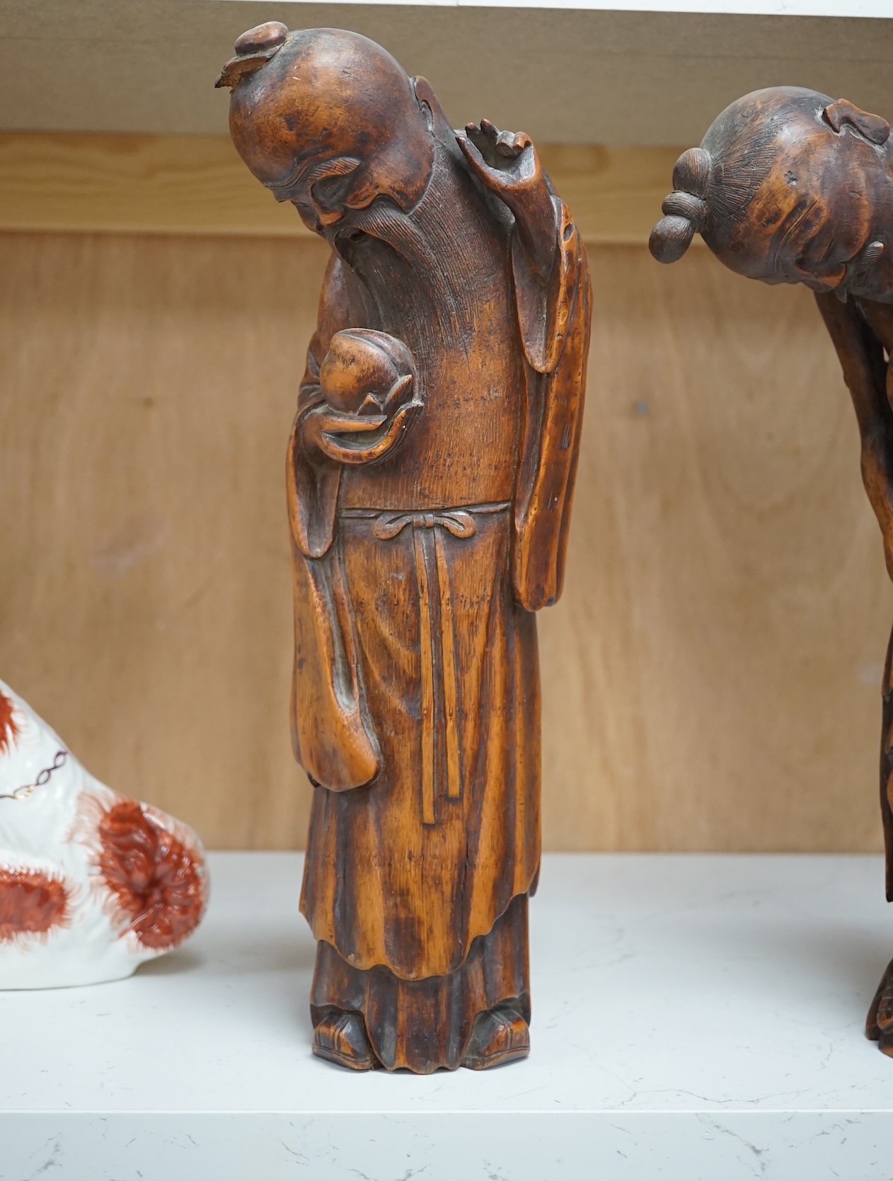 Two 19th century Chinese bamboo root figures of a fisherman and Shou Lao, tallest 32cm. Condition - fair to good